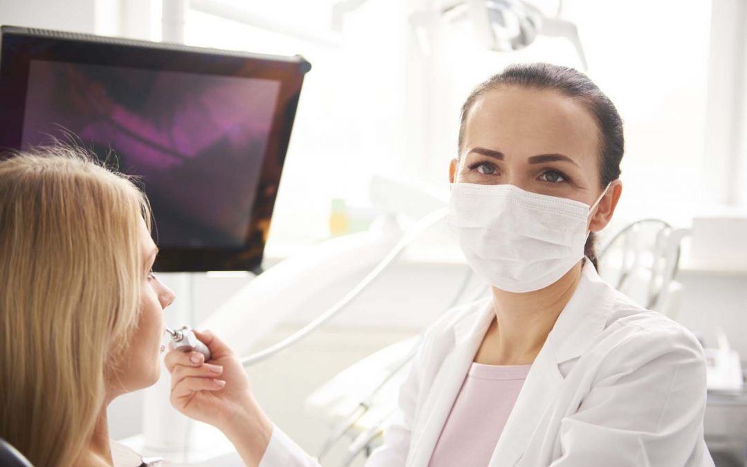Portrait of female dentist at work