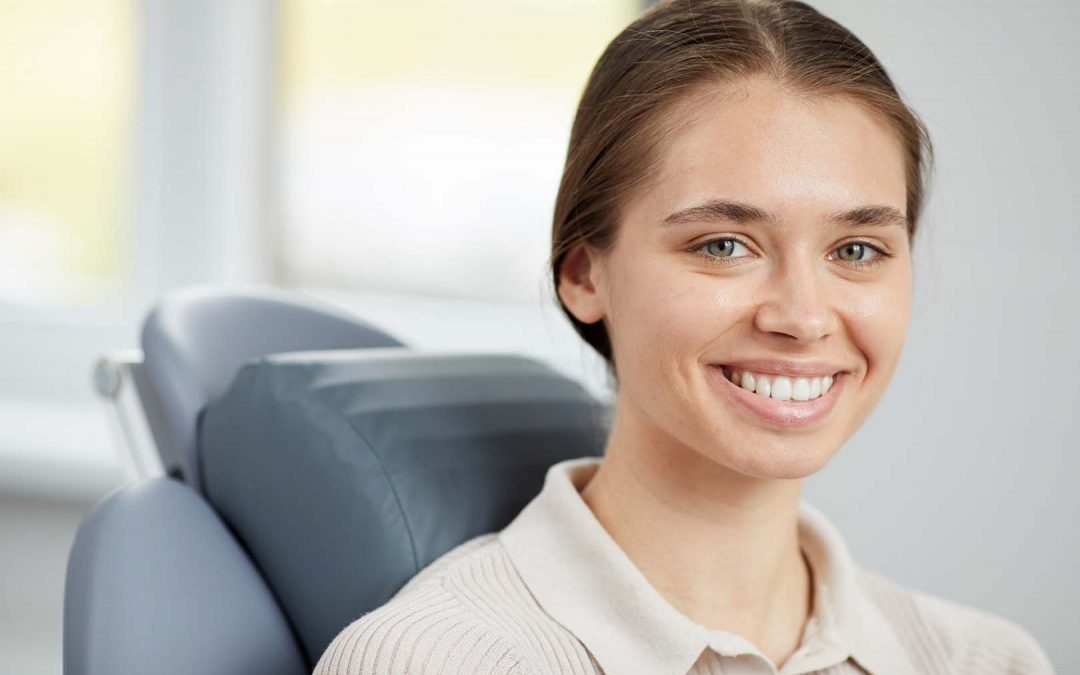 Pretty Young Woman in Dental Chair